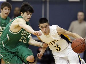 Delta's Tyson Schnitkey (23) defends against  Archbold's Gabe Rodriguez (3).