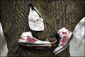 A memorial for slain DeShaun Lee is on a tree on the corner of Russell and Mulberry streets. The 16-year-old boy was crossing Russell near Mulberry when he was shot and killed on May 29, 2010.