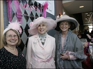Rita Krebs, Rebecca Ott and Pat Lewandowski wear hats to celebrate the Pretty in Pink fashion show and honor cancer survivors.