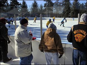 Spectators brave the cold to cheer on their favorites in a game between the Detroit MORC Stars and the Michigan FAR Flyers. The inaugural UCT Winter Hockey Festival kicked off Saturday. 