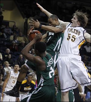 Toledo's Richard Wonnell, right, battles for a rebound in a game against Ohio on Wednesday.  The Genoa graduate, who plays for UT as a walk-on, has started the last two games for the Rockets, who are 11-13 overall and 3-7 in Mid-American Conference play.