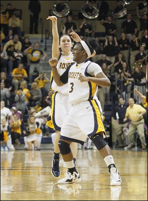UT's Courtney Ingersoll hits a 3-pointer as Lecretia Smith starts to celebrate.