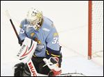 Walleye goalie Alec Richards makes a stop in the second period Sunday afternoon at the Huntington Center. Richards had 24 saves.