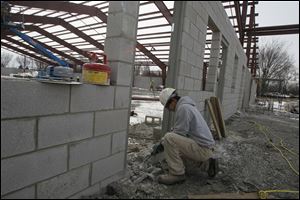 Christopher Nawrocki, of Swanton, working on a doorway for the new shop.