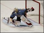  Walleye goalie Alec Richards makes a stop against the Cincinnati Cyclones earlier this week.