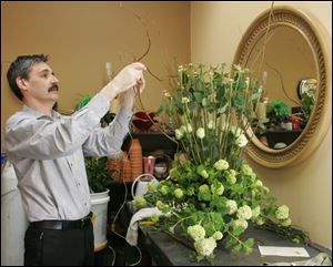 Mitch Bennett and his partner said their fl oral shop, which caters to offi ce workers in downtown Dayton, slightly exceeded sales expectations in the fi rst year after opening.