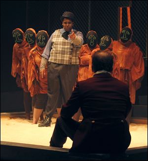 Creon (Timothy Fox), back, addresses Oedipus (William Toth) as they rehearse the play "King Oedipus" at the University of Toledo's Center for Performing Arts.