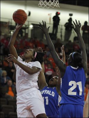 BGSU's Alexis Rogers, who had 16 points, shoots in front of Buffalo's Nytor Longar (21). The Falcons improved to 21-4 overall, 11-1 in the MAC.