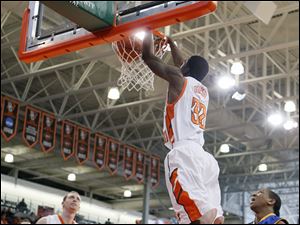Bowling Green State University forward Torian Oglesby (32) dunks the ball against  Morehead State Saturday, at the Stroh Center in Bowling Green, Ohio.
