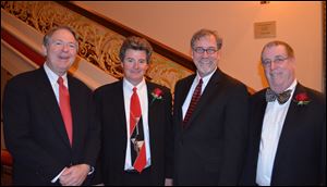 Toledo Jazz Orchestra board members showing off their red at Take  Your Valentine to the Valentine were, from left, John Fedderke, event chairman Scott Potter, Marty Porter, and Don Leary.