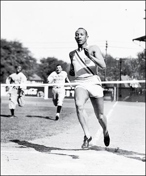 Olympian Jesse Owens, who won four golds in 1936, races Elmer Fleck of the Toledo Scales team in 1938 during an exhibition game at Swayne Field.