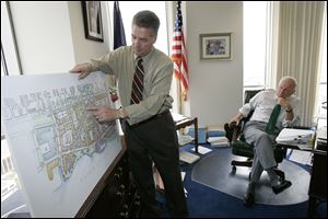 With Mayor Carty Finkbeiner looking on in his Government Center office in June, 2008, developer Larry Dillin goes over his plans for the Marina District.