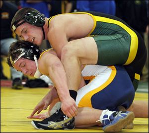 Clay's Jarred Gray defeats Whitmer's Nick LaPoint 7-2  in the 220-pound championship match at the Division I wrestling sectional. Clay will send 14 to the district meet.