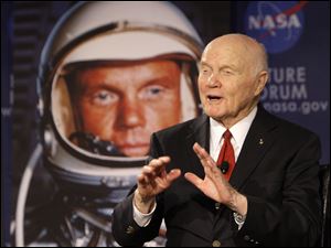 Sen. John Glenn talks, via satellite, with the astronauts on the International Space Station, before the start of a roundtable discussion titled "Learning from the Past to Innovate for the Future"  on Monday in Columbus. Mr. Glenn was the first American to orbit Earth, piloting Friendship 7 around it three times in 1962, and also became the oldest person in space, at age 77, by orbiting Earth with six astronauts aboard shuttle Discovery in 1998. 