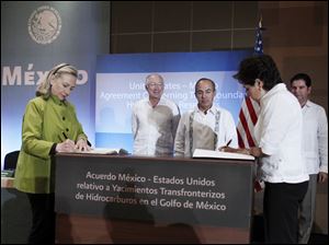 Secretary of State Hillary Rodham Clinton and Mexico's Foreign Minister Patricia Espinosa, sign the US-Mexico Agreement Concerning Transboundary Hydrocarbon Reservoirs in the Gulf of Mexico, Monday in Los Cabos, Mexico. 