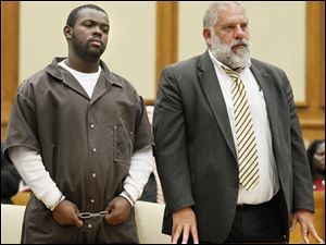 Byron Mitchell, with attorney Pete Rost, is sentenced to nine years in prison by Judge Gene Zmuda, in Lucas County Common Pleas Court.  He previously entered an Alford plea to involuntary manslaughter with a gun specification and was found guilty in the shooting death of Eric Daniels on July 3, 2011.