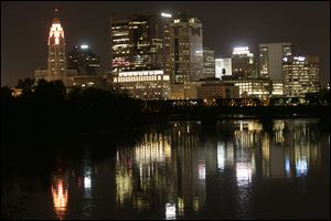 Columbus’ skyline is bright at night, but most people have gone home from their day jobs.