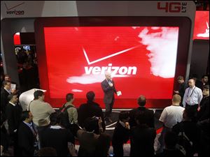 Consumer Electronics Show attendees check out the unveiling of 4G devices at the Verizon booth in Las Vegas last month.