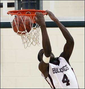 Scott's Shaquille Allen (4) dunks the ball against  Bowsher during the City League boys semifinals Tuesday, at Start High School in Toledo, Ohio.
