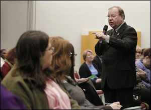 Mike Bower, president of Lake Region State College in Devils Lake, N.D., addresses a forum at the Perrysburg Township campus.
