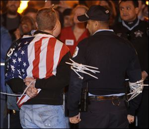 A protester is arrested by Chicago police during an Occupy Chicago march and protest last year in Grant Park. 