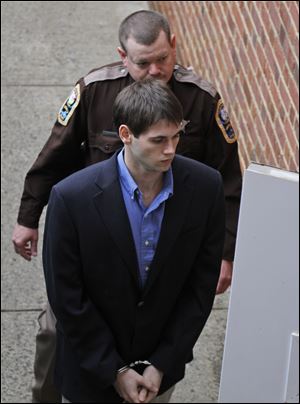 George Huguely V , front, is escorted into the Charlottesville Circuit courthouse  in Charlottesville, Va., Wednesday.