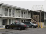  A Perrsyburg Police cruiser parked outside the Econolodge Wednesday where two people were found dead.