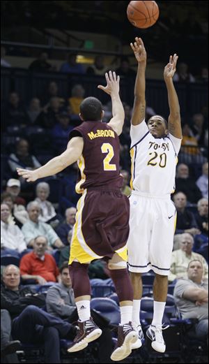 Toledo guard Julius Brown, who scored 29 points, takes a shot against Central Michigan's Austin McBroom. The freshman led the Rockets to their third win in a row and second straight in the MAC West.