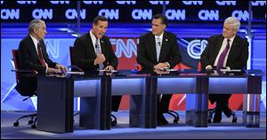 The remaining Republican presidential candidates, from left, Ron Paul, Rick Santorum, Mitt Romney, and Newt Gingrich spar during a debate hosted by CNN and the Arizona Republican Party in Mesa, Ariz.