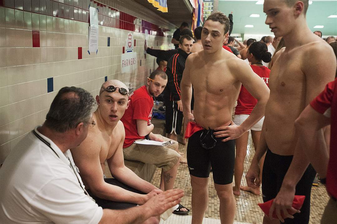 Dan-DiSalle-seated-Connor-Trimble-center-and-Nick-Brodie-members-of-the-Toledo-St-Francis-De-Sales-Men-s-200-yard-Freestyle-Relay-team