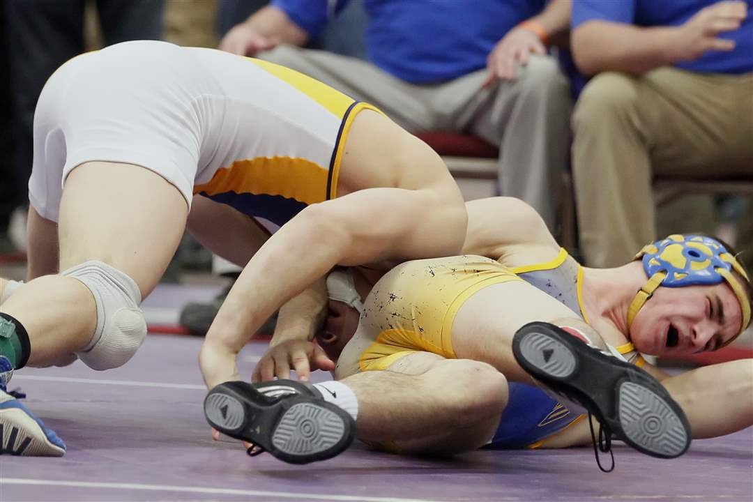 Archbold-s-Jordan-Cowell-pins-Nick-Miller-of-Ontario-in-the-152-pound-weight-class-during-the-finals-of-Division-III-district-tournament