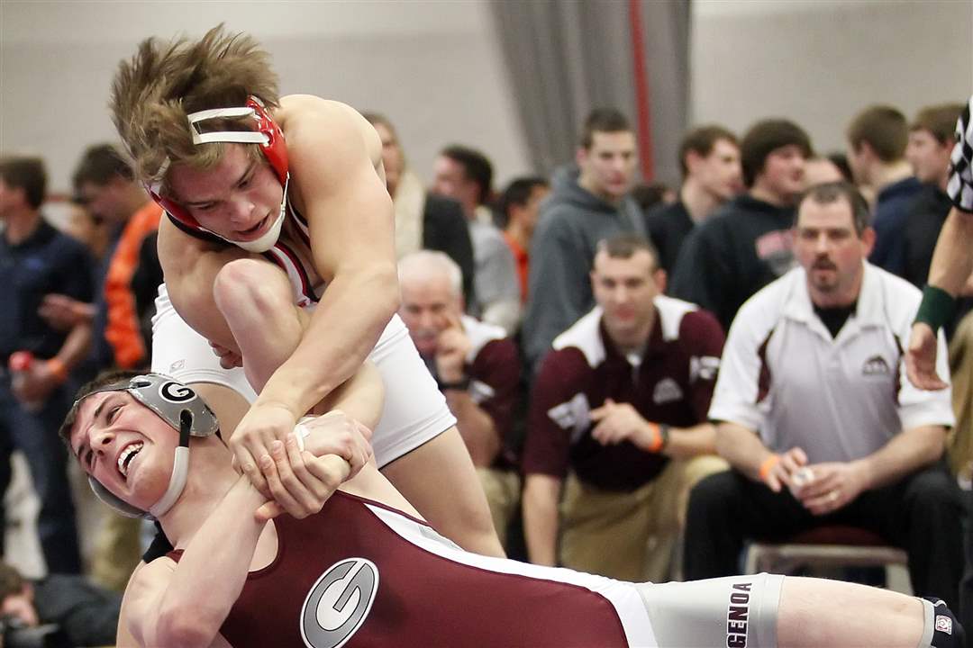 Jake-Sheehy-of-Genoa-grapples-with-Christian-Peters-of-Cardinal-Stritch-in-the-182-pound-match