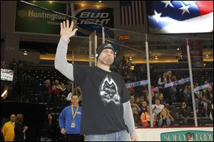 Darren McCarty waves to fans at the Huntington Center on Friday night. The former Red Wing forward played from 1993-2009 with Detroit and won four Stanley Cups.