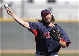 Cleveland Indians relief pitcher Chris Perez throws during a spring training baseball workout in Goodyear, Ariz., Thursday.