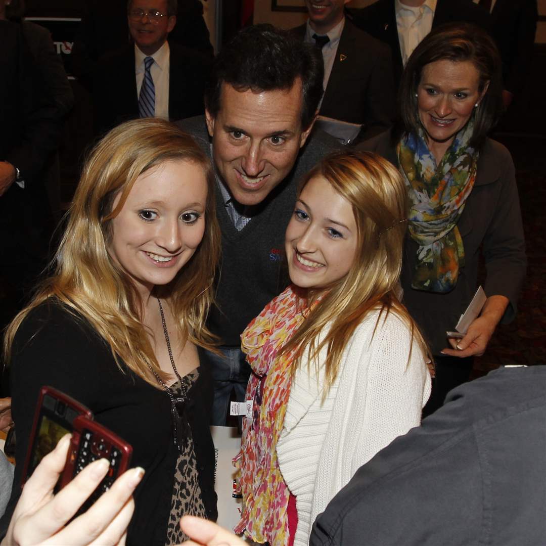 Republican-presidential-candidate-Rick-Santorum-speaks-poses-for-photos