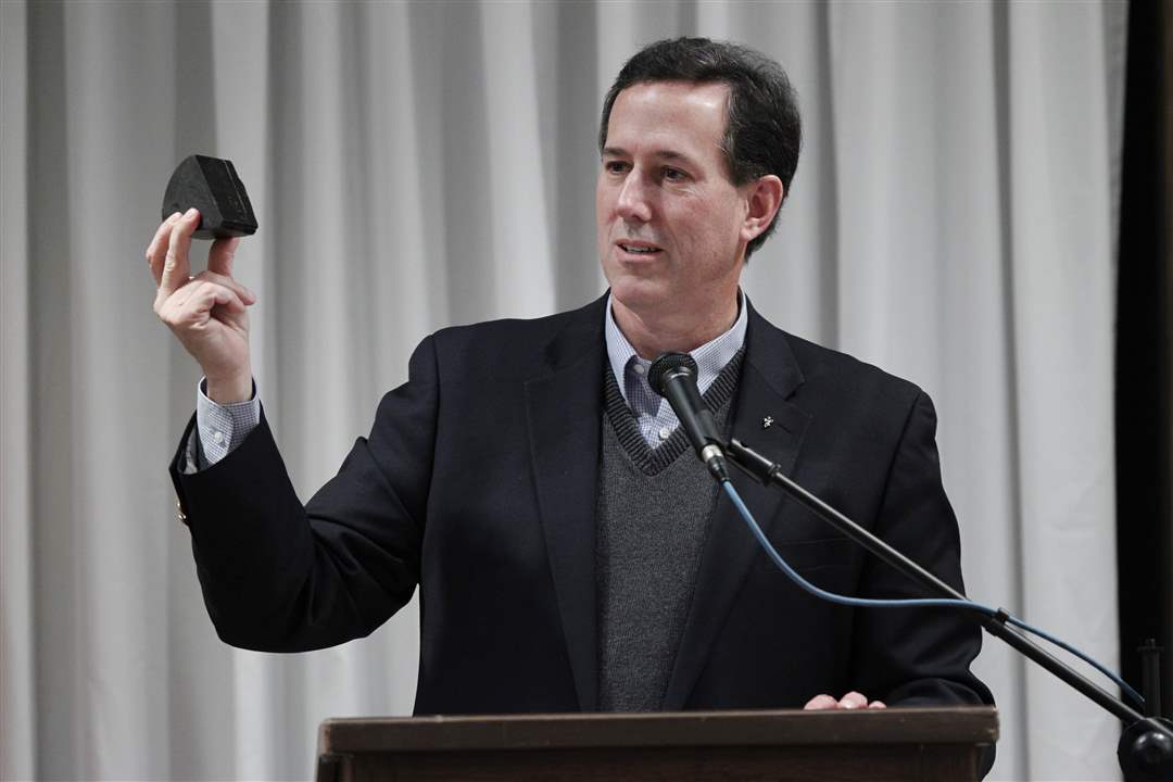 Republican-presidential-candidate-Rick-Santorum-holds-up-a-piece-of-oil-shale