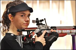 Sarah Scherer battled through a head cold to qualify for the U.S. Olympic team in the 10-meter air rifle.
