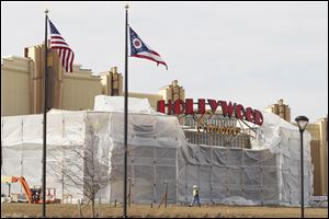 Hollywood Casino Toledo has taken the wraps off its sign, and its slot machines are expected to arrive this week. State regulators recently decided the Las Vegas-style casino in East Toledo may open its doors no earlier than May 29, awarding Rock Caesars Ohio the honor of opening its Horseshoe Casino in Cleveland first, during the week of May 14. Others are planned in Columbus and Cincinnati.