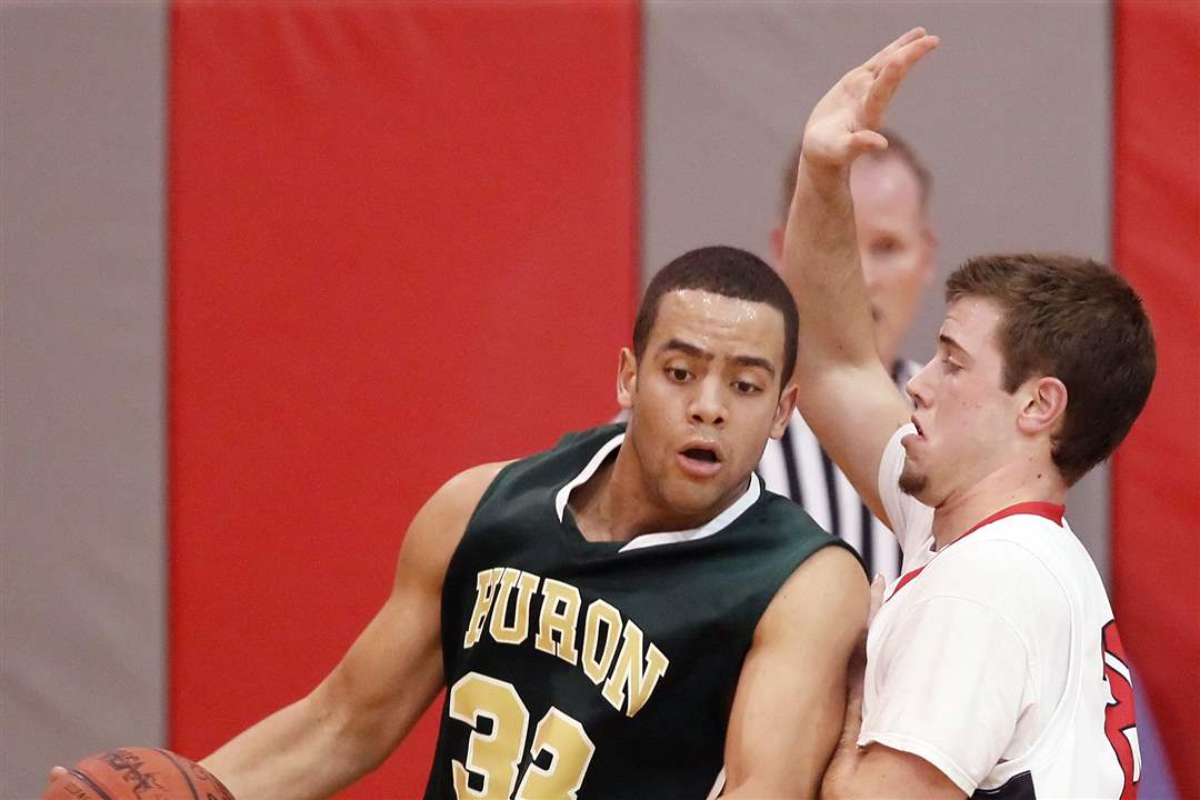 Ann-Arbor-Huron-s-Mike-Lewis-33-drives-to-the-hoop