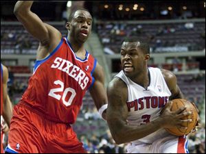 Detroit Pistons' Rodney Stuckey (3) drives against Philadelphia 76ers' Jodie Meeks (20) in the second half of an NBA basketball game, Tuesday, Feb. 28, 2012, in Auburn Hills, Mich. The 76ers defeated the Pistons 97-68. (AP Photo/Duane Burleson)