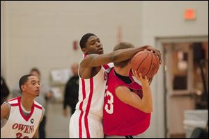 Franklin Lindsey, a former player for Whitmer High School, blocks a pass. Coach Dave Clarke, in his first year at Owens, says, 'Franklin is the hardest-working kid on the team,' going after loose balls and playing strong defense.