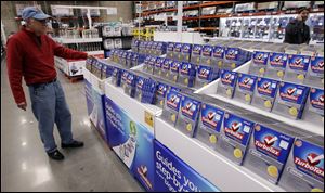 A shopper looks at a copy of TurboTax on sale at Costco in Mountain View, Calif. 