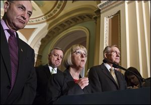 Senate Democrats speak with reporters on Capitol Hill in Washington after they defeated a Republican effort to roll back President Barack Obama's policy on contraception insurance coverage. From left are, Sen. Charles Schumer, D-N.Y., Senate Majority Whip Richard Durbin of Ill., Sen. Patty Murray, D-Wash., and Senate Majority Leader Harry Reid of Nev.