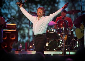 Davy Jones and the Monkees play in Lexington, Ky., on May 27, 2001. Jones, the heartthrob lead singer, died Wednesday of an apparent heart attack. He was 66.
