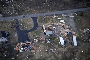 Storm damage in an area between Henryville and Marysville, Ind. is seen Friday, in Marysville, Ind.  Powerful storms stretching from the Gulf Coast to the Great Lakes flattened buildings in several states, wrecked two Indiana towns and bred anxiety across a wide swath of the country in the second powerful tornado outbreak this week. 