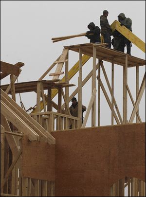 A house goes up in Newtown, Pa. Some analysts see the economy building to where growth is great enough to spur more growth.  
