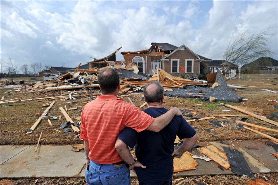 Jerry-Vonderhaar-left-comforts-Charles-Kellogg-after-severe-weather