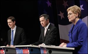 Democrats, from left, Graham Veysey, Dennis Kucinich, and Marcy Kaptur take part in a 9th District debate on Feb. 24 at Woodward High School in Toledo.
