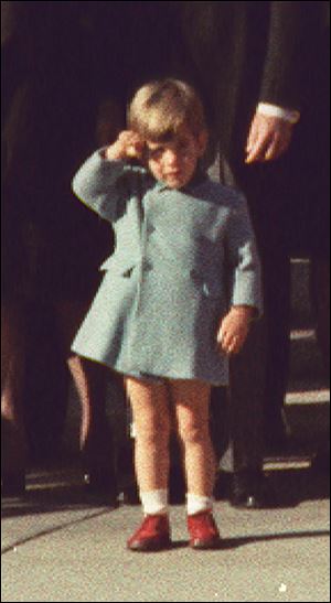 John F. Kennedy, Jr., salutes his father's coffin at the Cathedral of St. Matthew.