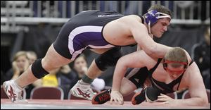 Mimmo Lytle, left, of Swanton controls Nino Majoy of Huron in the Division III 285-pound final Saturday at Value City Arena in Columbus. Lytle won 1-0 to take his second straight state championship.